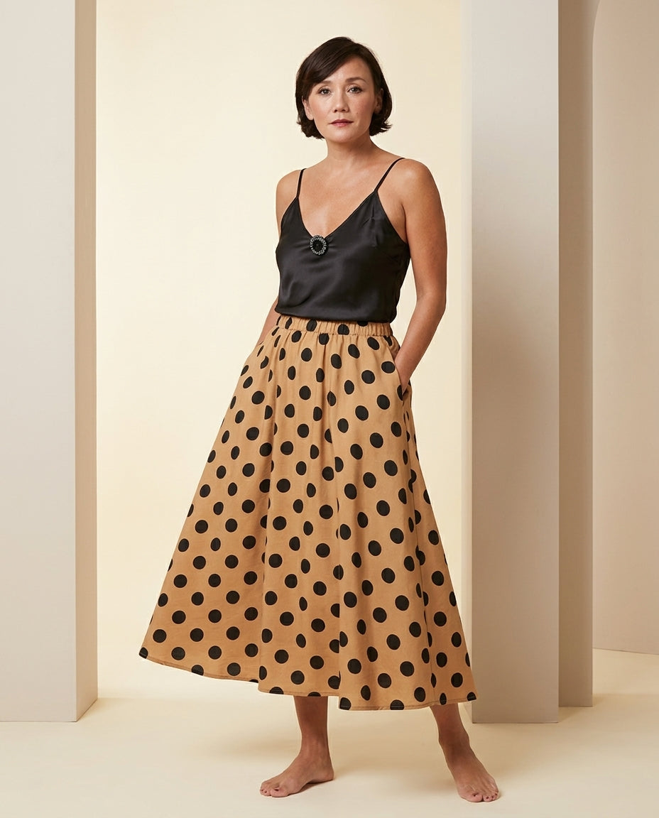 Sand Charm Summer Polka Dot Maxi Skirt Sand Maxi Skirt with Asymmetric silhouette and Textured texture, front view product image for Summer Edit, a London dinner reservation, Euro Chic Premium by floravincie