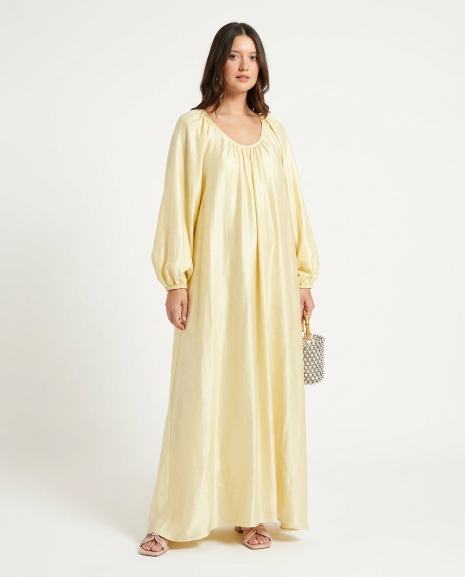 Pale Yellow Glow Resort Satin Maxi Dress Pale Yellow Maxi Dress with Relaxed Fit silhouette and Satin texture, clean studio product view for Resort Wear, an estate dinner at golden hour, US East / Hamptons Elite by floravincie