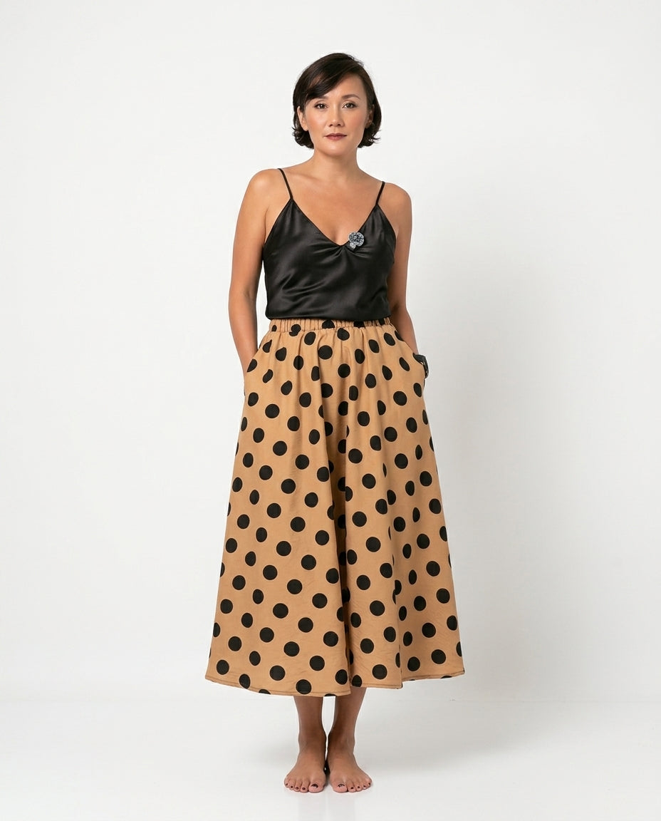 Sand Charm Summer Polka Dot Maxi Skirt Sand Maxi Skirt with Asymmetric silhouette and Textured texture, clean studio product view for Summer Edit, a London dinner reservation, Euro Chic Premium by floravincie