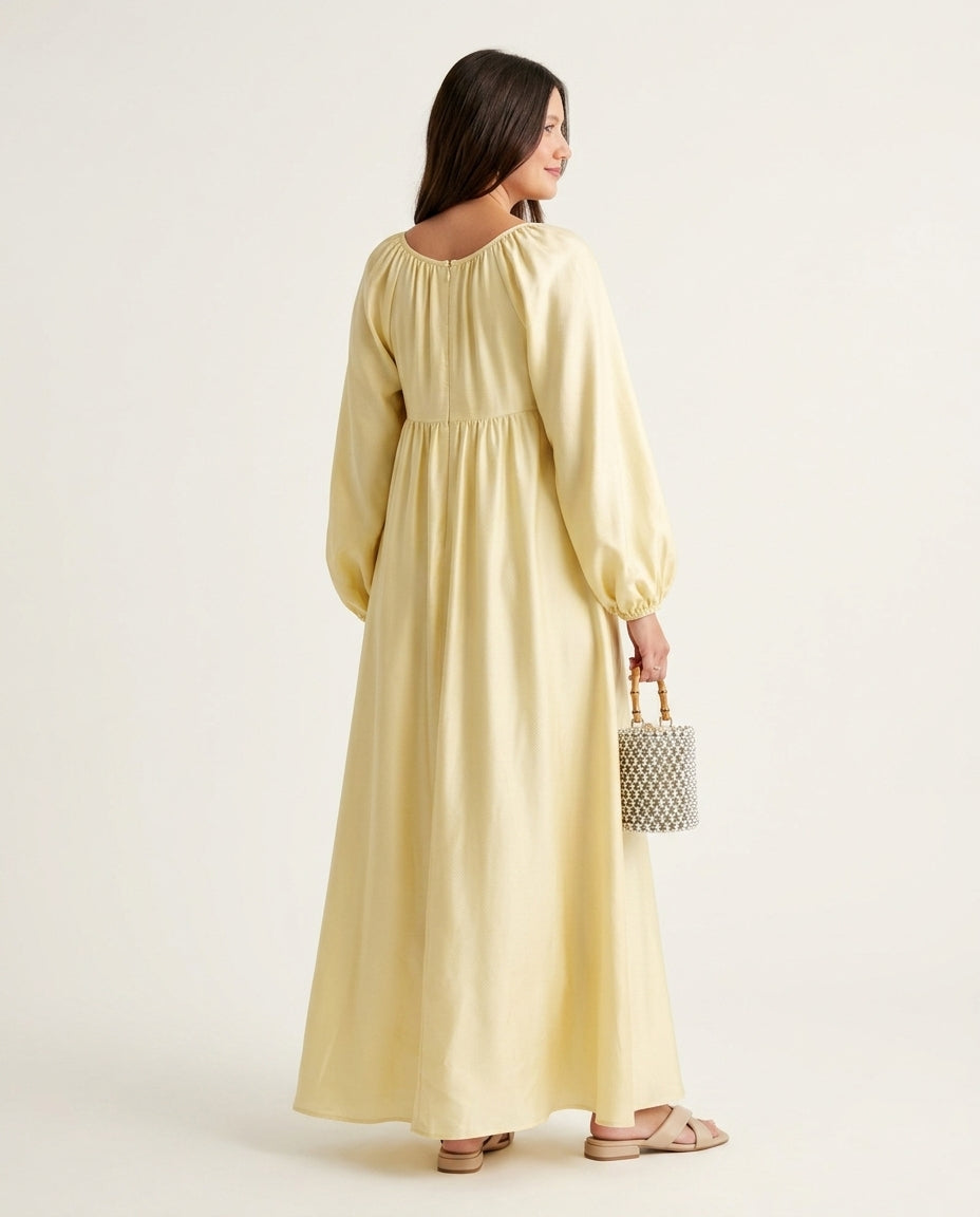 Pale Yellow Glow Resort Satin Maxi Dress Pale Yellow Maxi Dress with Relaxed Fit silhouette and Satin texture, side or back garment view for Resort Wear, an estate dinner at golden hour, US East / Hamptons Elite by floravincie