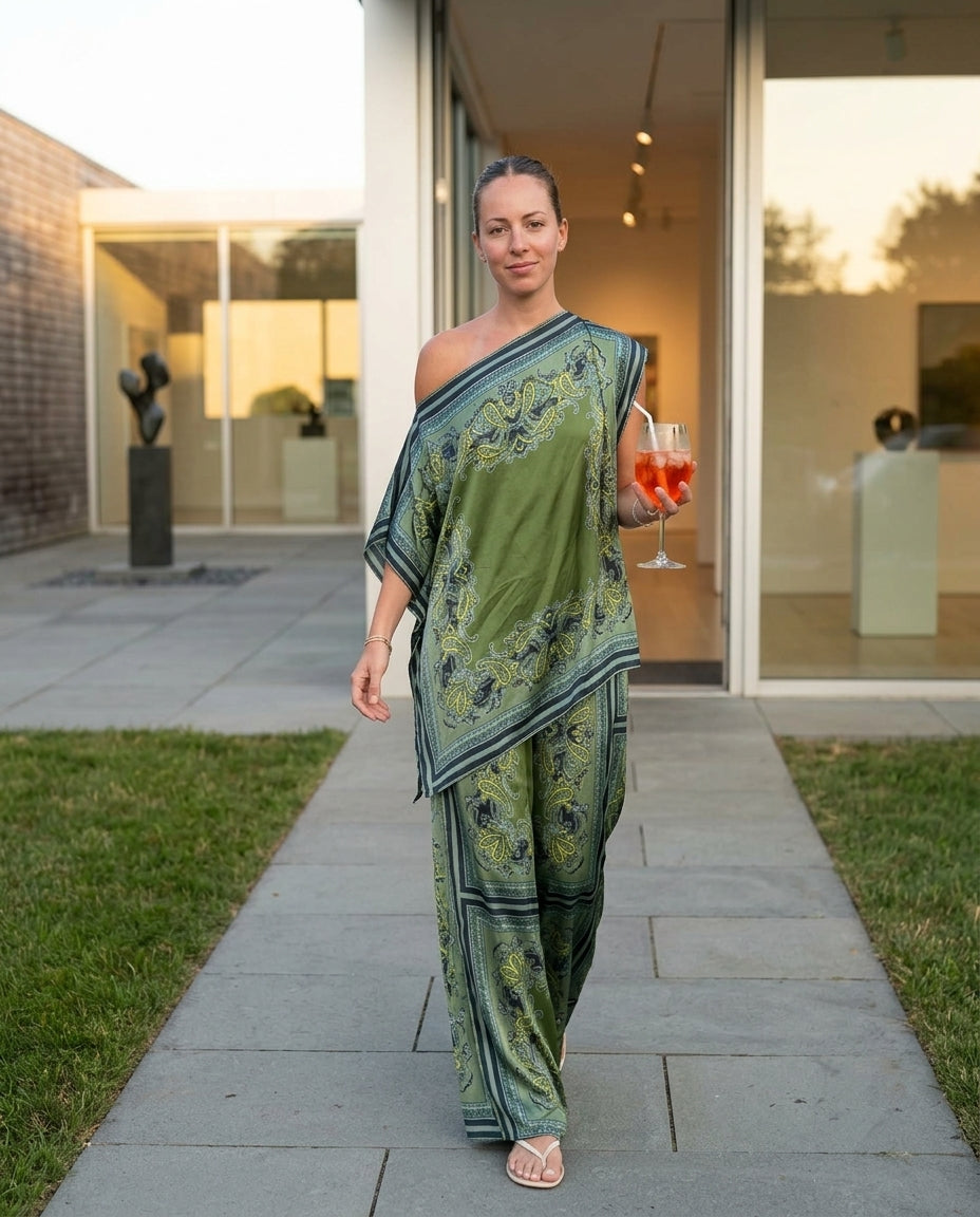 Sage Aura Wedding Guest Paisley Jumpsuit Sage Jumpsuit with Asymmetric silhouette and Satin texture, lifestyle scene image for Wedding Guest, a cafe plan, Fall current summer selling first with a light late-summer/pre-fall accent: make it wearable now for by floravincie