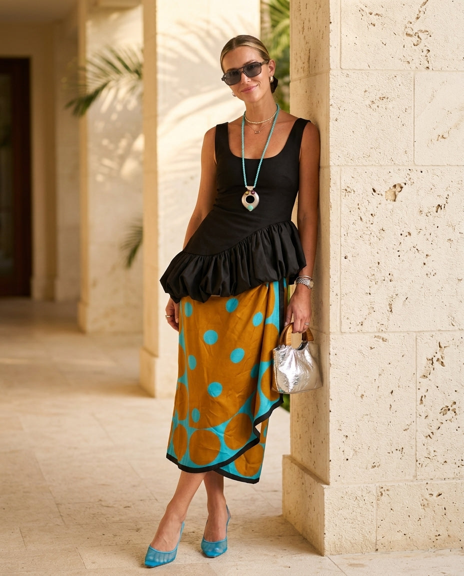Black Allure Summer Polka Dot Skirt Set Black Skirt Set with Relaxed Fit silhouette and Textured texture, lifestyle scene image for Vacation Set, a gallery opening in Paris, Euro Chic Premium