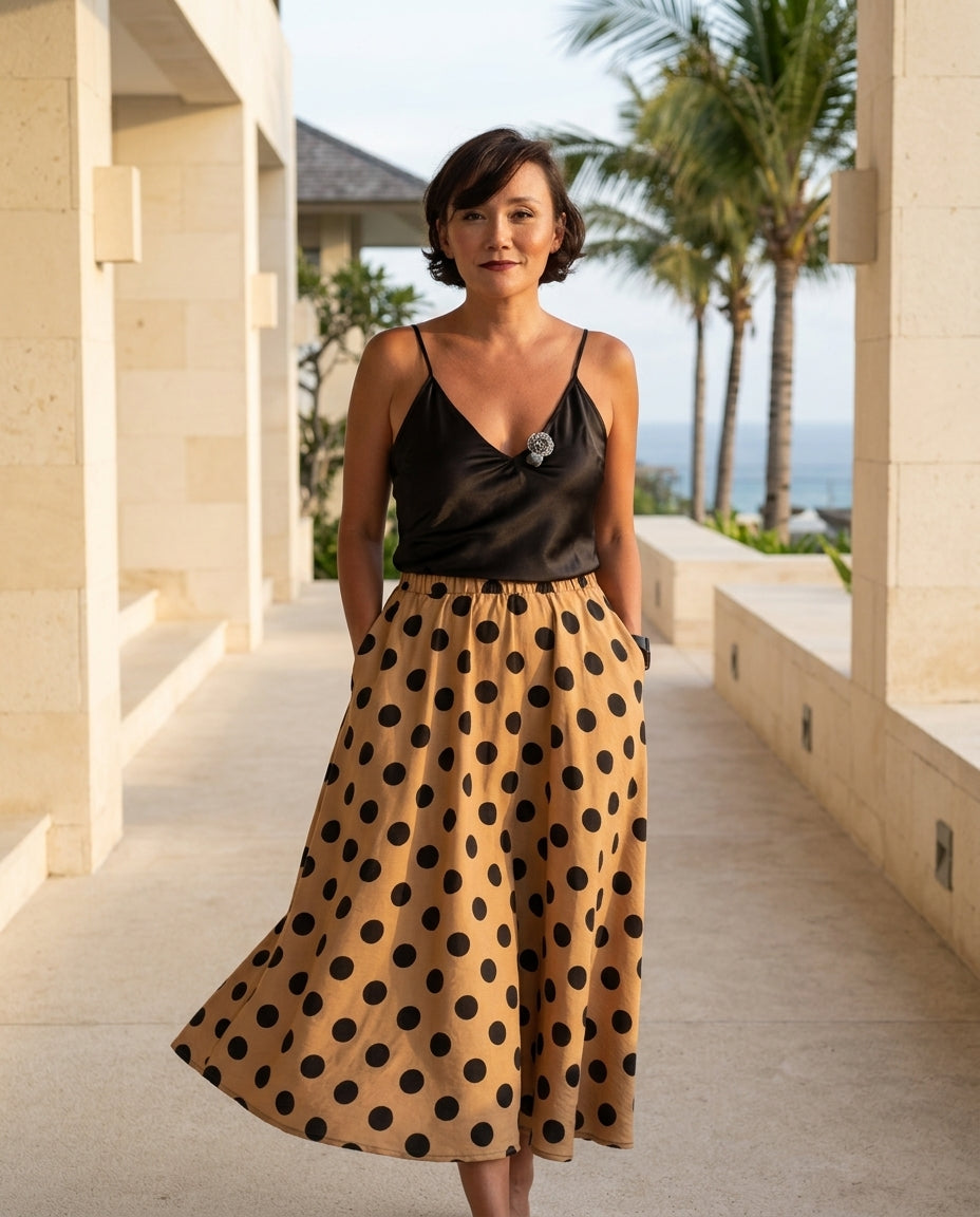 Sand Charm Summer Polka Dot Maxi Skirt Sand Maxi Skirt with Asymmetric silhouette and Textured texture, lifestyle scene image for Summer Edit, a London dinner reservation, Euro Chic Premium by floravincie