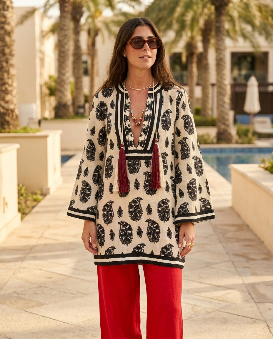 Sand Whisper Resort Paisley Maxi Dress Sand Maxi Dress with Asymmetric silhouette and Linen Blend texture, lifestyle scene image for Resort Wear, a gallery opening in Paris, Euro Chic Premium by floravincie