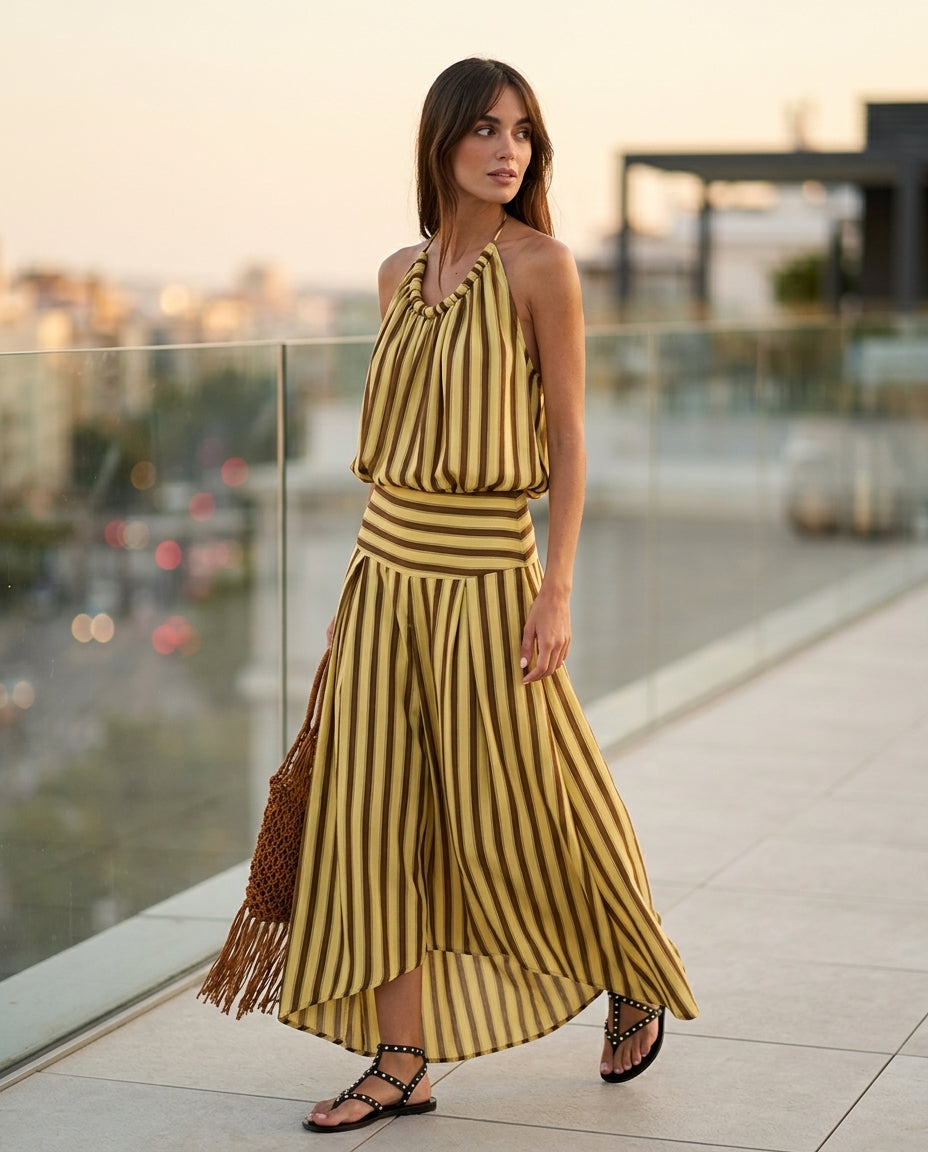 Butter Yellow Charm Resort Striped Romper Butter Yellow Romper with Relaxed Fit silhouette and Textured texture, outdoor styling image for Resort Wear, an estate dinner at golden hour, US East / Hamptons Elite by floravincie