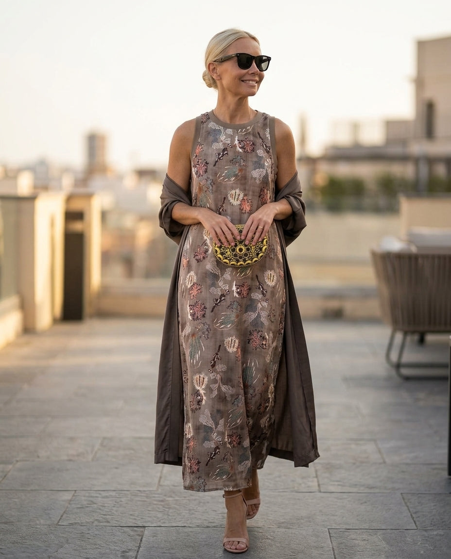 Brown Whisper Summer Embroidered Maxi Dress Brown Maxi Dress with Asymmetric silhouette and Textured texture, outdoor styling image for Resort Dinner, Weekend in The Hamptons, US East / Hamptons Elite by floravincie