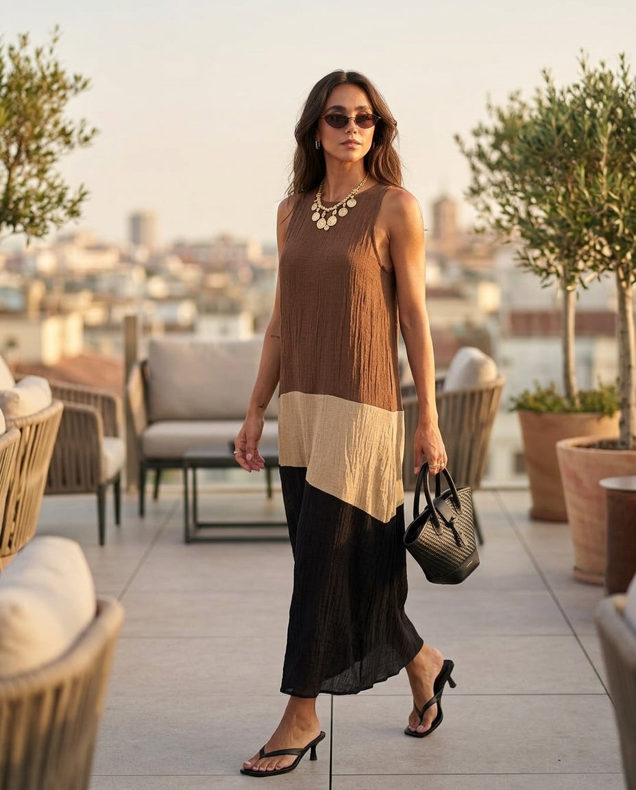 Brown Charm Resort Textured Maxi Dress Brown Maxi Dress with Asymmetric silhouette and Textured texture, outdoor styling image for Resort Wear, an estate dinner at golden hour, US East / Hamptons Elite by floravincie