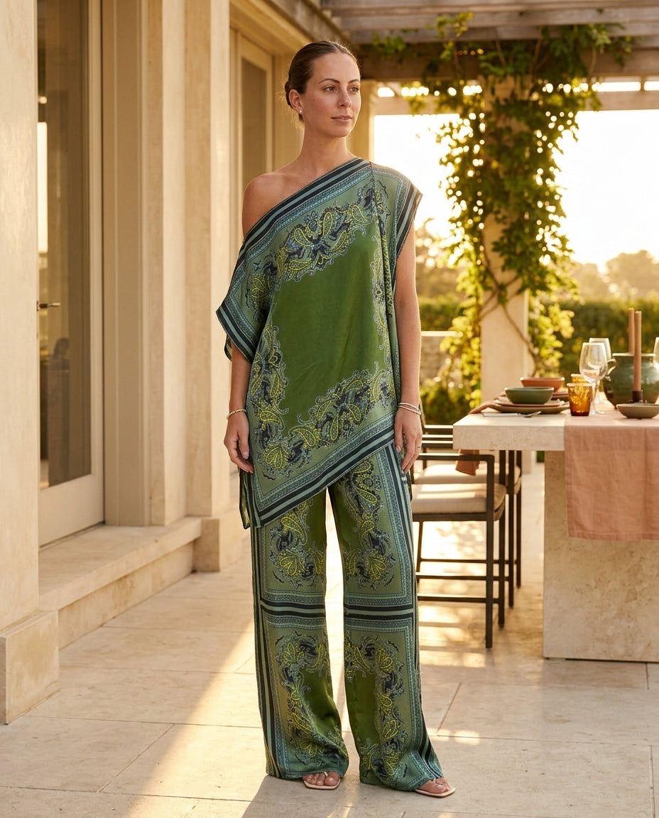 Sage Aura Wedding Guest Paisley Jumpsuit Sage Jumpsuit with Asymmetric silhouette and Satin texture, editorial ecommerce scene for Wedding Guest, a cafe plan, Fall current summer selling first with a light late-summer/pre-fall accent: make it wearable now by floravincie