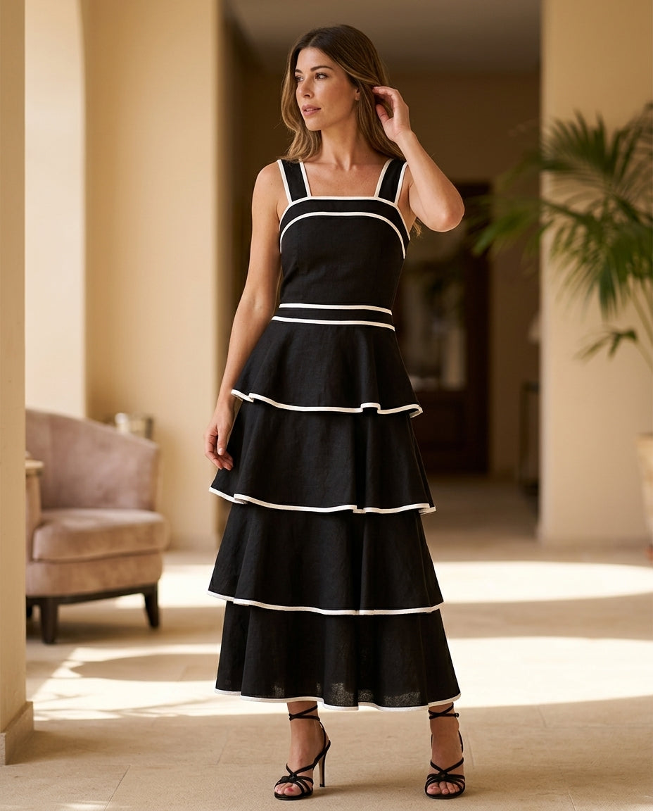 Black Aura Resort Tiered Romper Black Romper with Structured silhouette and Textured texture, editorial ecommerce scene for Resort Wear, a Palm Springs weekend, US Coastal Glam by floravincie