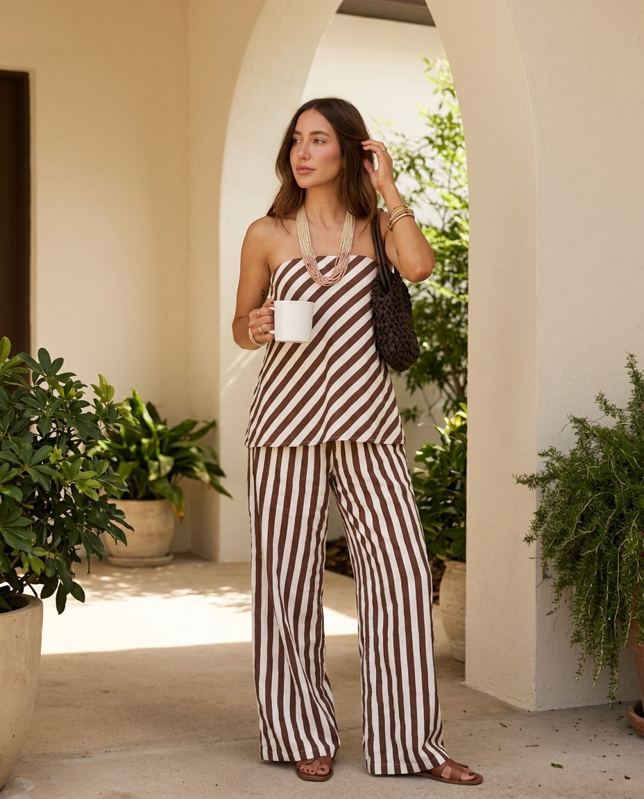 Brown Eyelet Strapless Pant Set "Serena" Brown Pant Set with Asymmetric silhouette and Linen Blend texture, editorial ecommerce scene for Resort Wear, a polished coastal brunch, US East / Hamptons Elite
