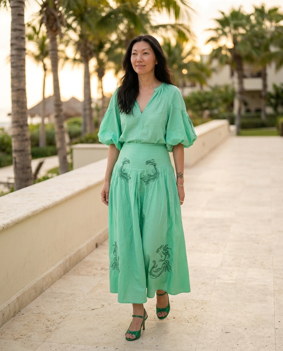 Mint Green Eyelet V-Neck Skirt Set "Chiara" Mint Green Skirt Set with Relaxed Fit silhouette and Textured texture, lifestyle scene image for Resort Wear, a London dinner reservation, Euro Chic Premium