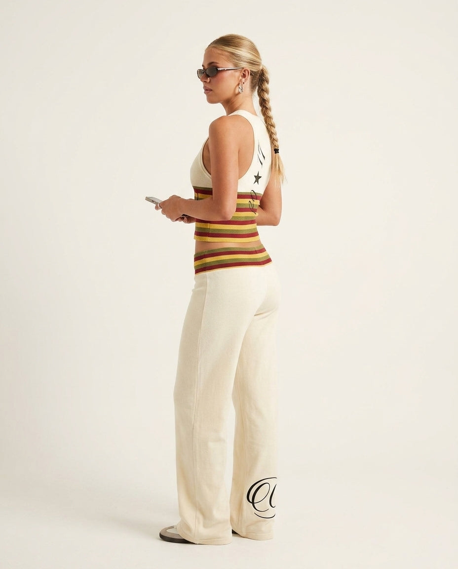 Ivory Eyelet V-Neck Pant Set "Mara" Ivory Pant Set with Wide-Leg silhouette and Textured texture, clean studio product view for Weekend Escape, a polished coastal brunch, US East / Hamptons Elite