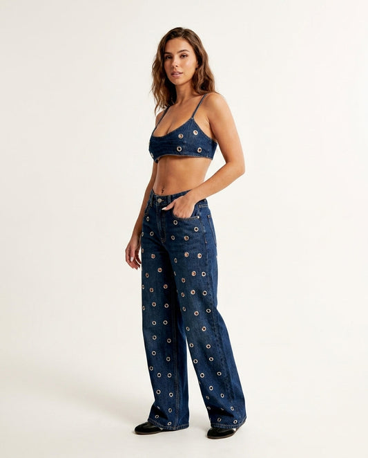 Denim Eyelet V-Neck Pant Set "Margot" Denim Pant Set with Wide-Leg silhouette and Textured texture, clean studio product view for Weekend Escape, Sunset in Malibu, US Coastal Glam