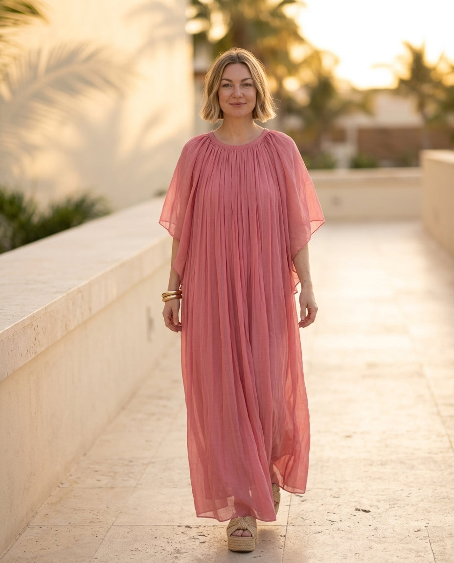 Blue Eyelet V-Neck Maxi Dress "Isla" Blue Maxi Dress with Relaxed Fit silhouette and Textured texture, lifestyle scene image for Rooftop Brunch, a private garden lunch, US East / Hamptons Elite