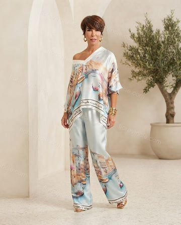 Light Blue Aura Vacation Edit Printed Pant Set Light Blue Pant Set with Asymmetric silhouette and Satin texture, front view product image for Pre-Fall, an office-to-dinner transition, Fall current summer selling first with a light late-summer/pre-fall acc by floravincie