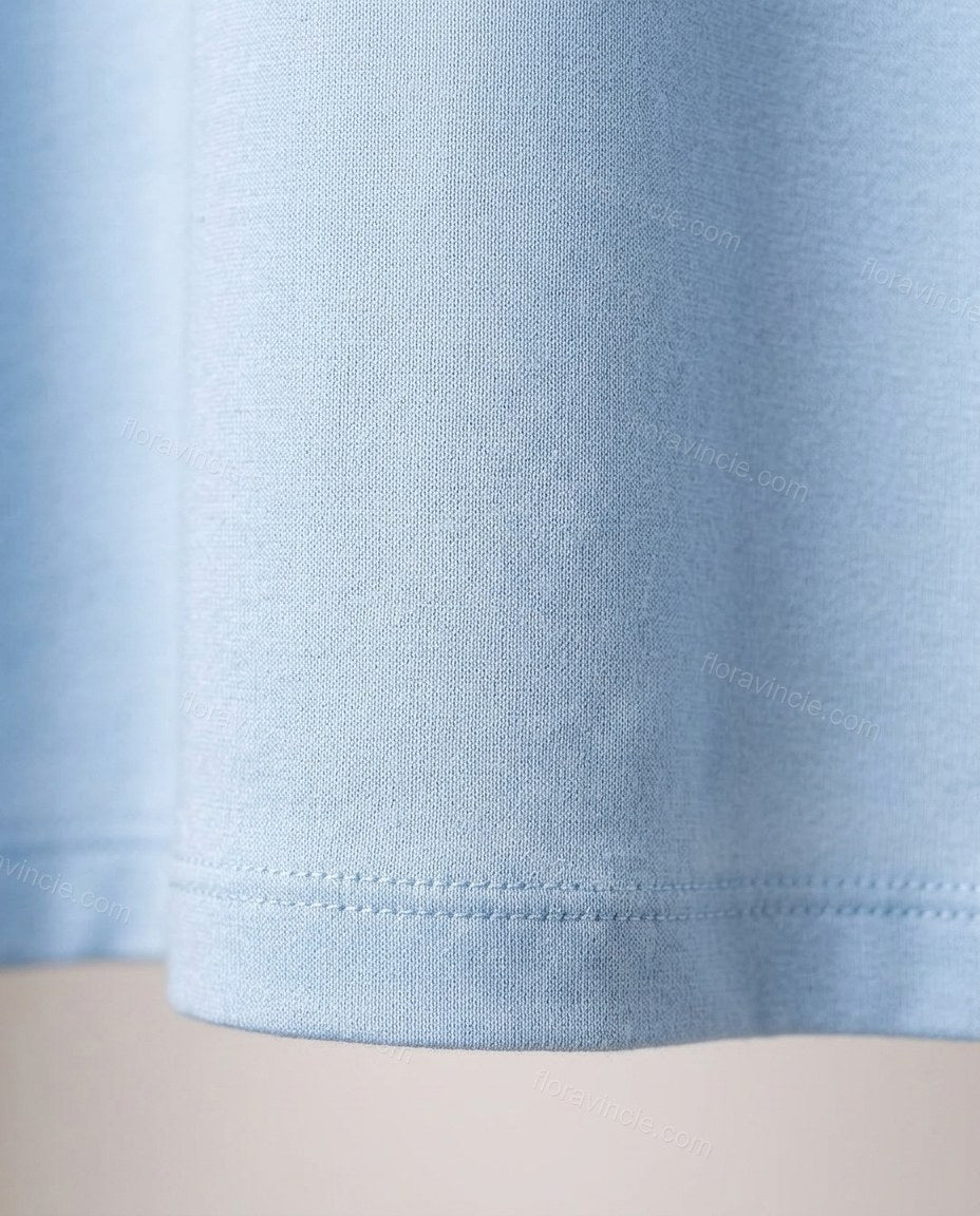 Light Blue Maxi Dress, close-up of gathered bodice, cut-out detail at center front and deep plunging neckline, by Floravincie