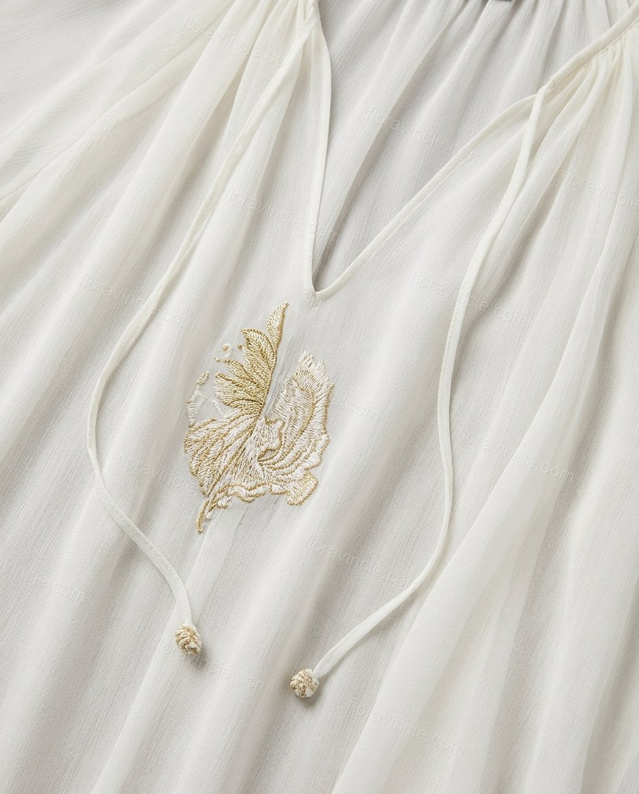 Off-white Maxi Embroidered Ruffled Dress, close-up of neckline ties, gathered neckline and embroidered front detail, by Floravincie